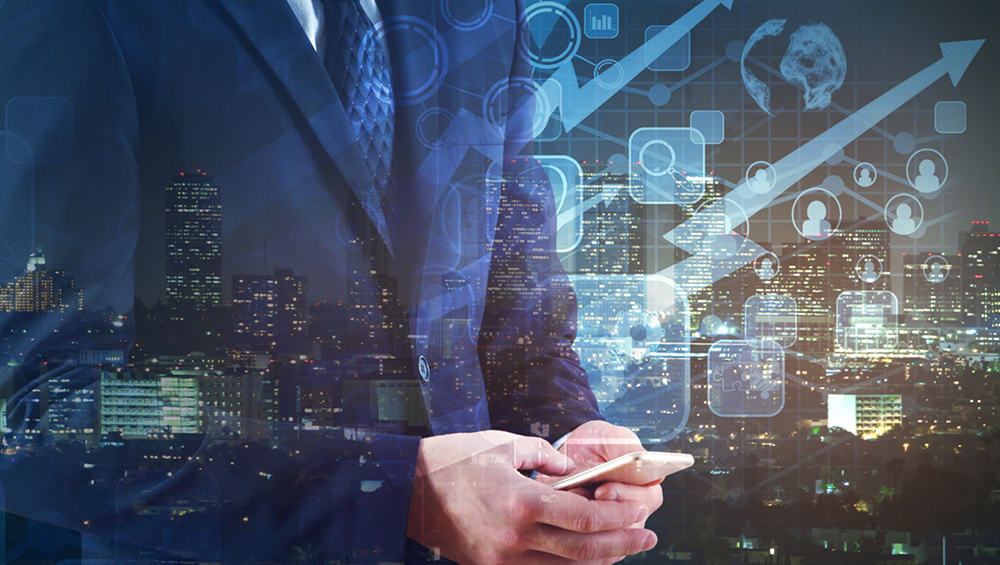 Double exposure image of a businessman using a smartphone, overlaid with a city skyline and digital business growth charts and icons.