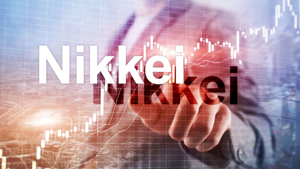The word "Nikkei" in large white letters overlaid on a financial graph with an upward trend, and a blurred hand pointing toward the chart.
