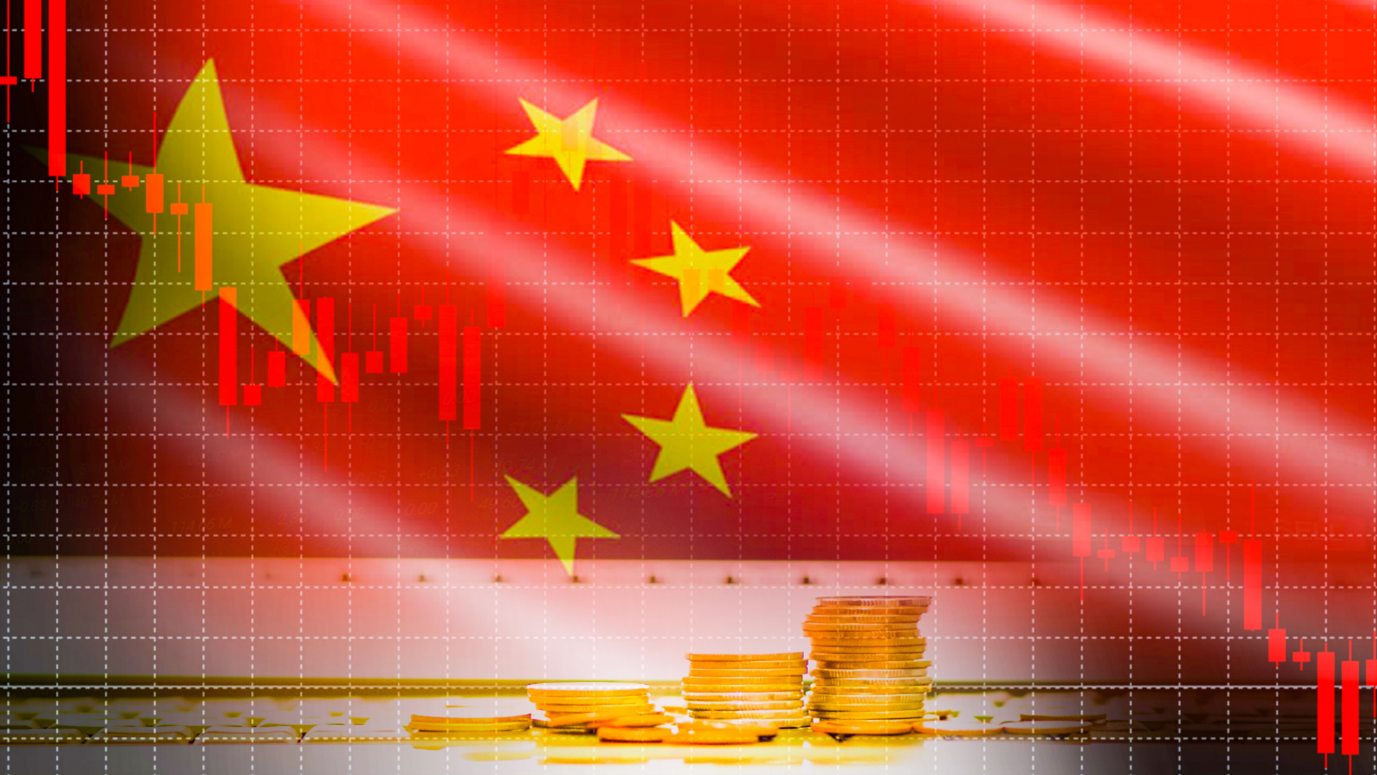 Stacked gold coins and a falling red candlestick chart overlaid on the flag of China, symbolizing an economic downturn.