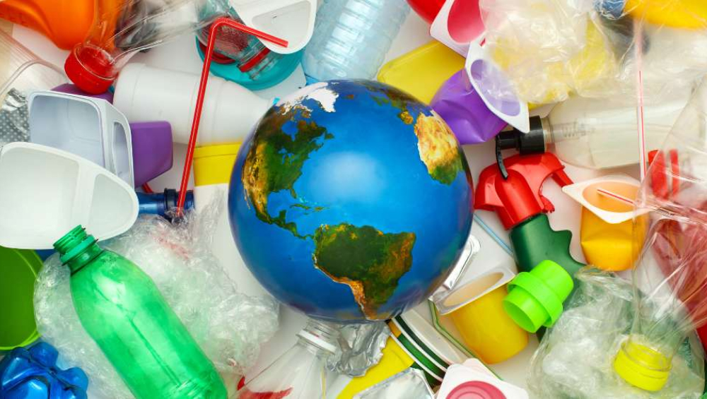 Globe surrounded by plastic waste highlighting global plastic pollution