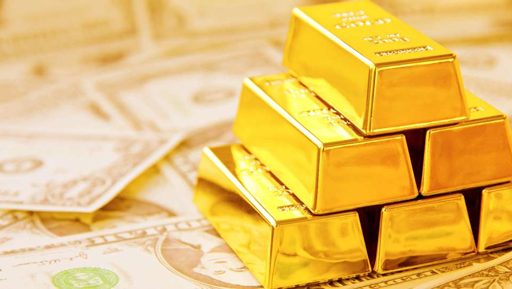 Stack of shiny gold bars resting on a bed of faded US dollar bills, symbolizing wealth and investment.