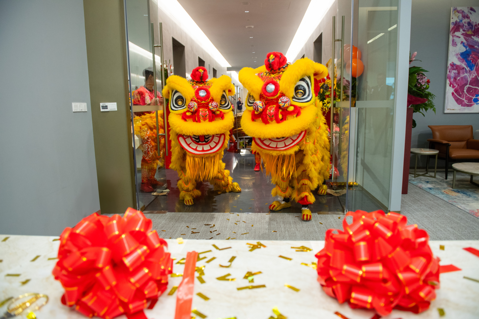 Lion dance performance entering Orient Futures Singapore’s new office during grand opening ceremony