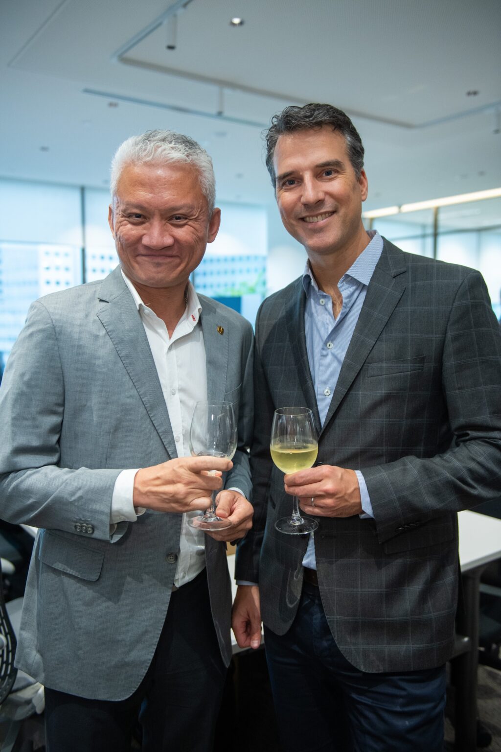 Head of Sales posing with guests at Orient Futures Singapore’s grand opening celebration