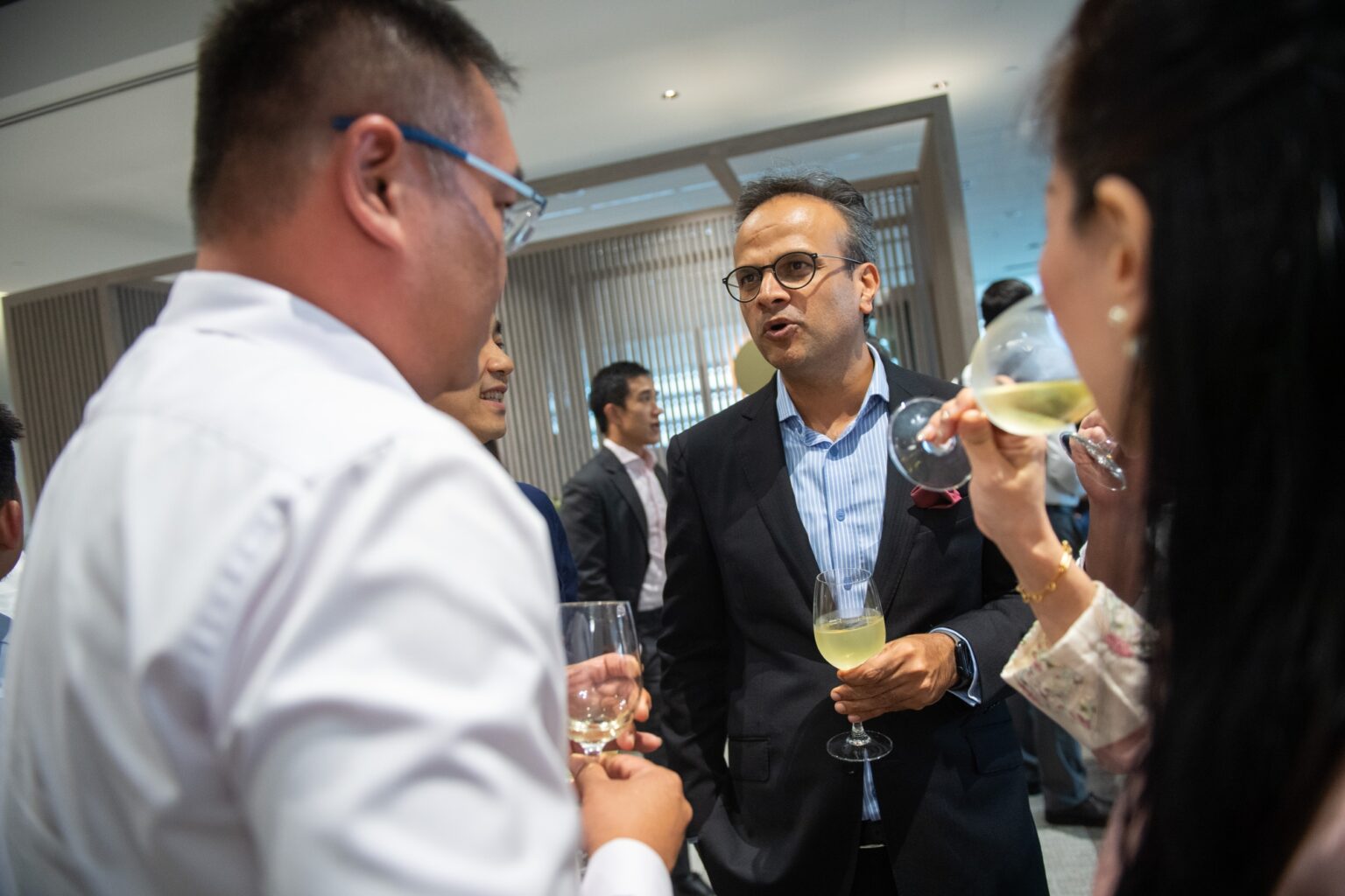 Orient Futures Singapore CFO speaking with guests during the company’s office grand opening