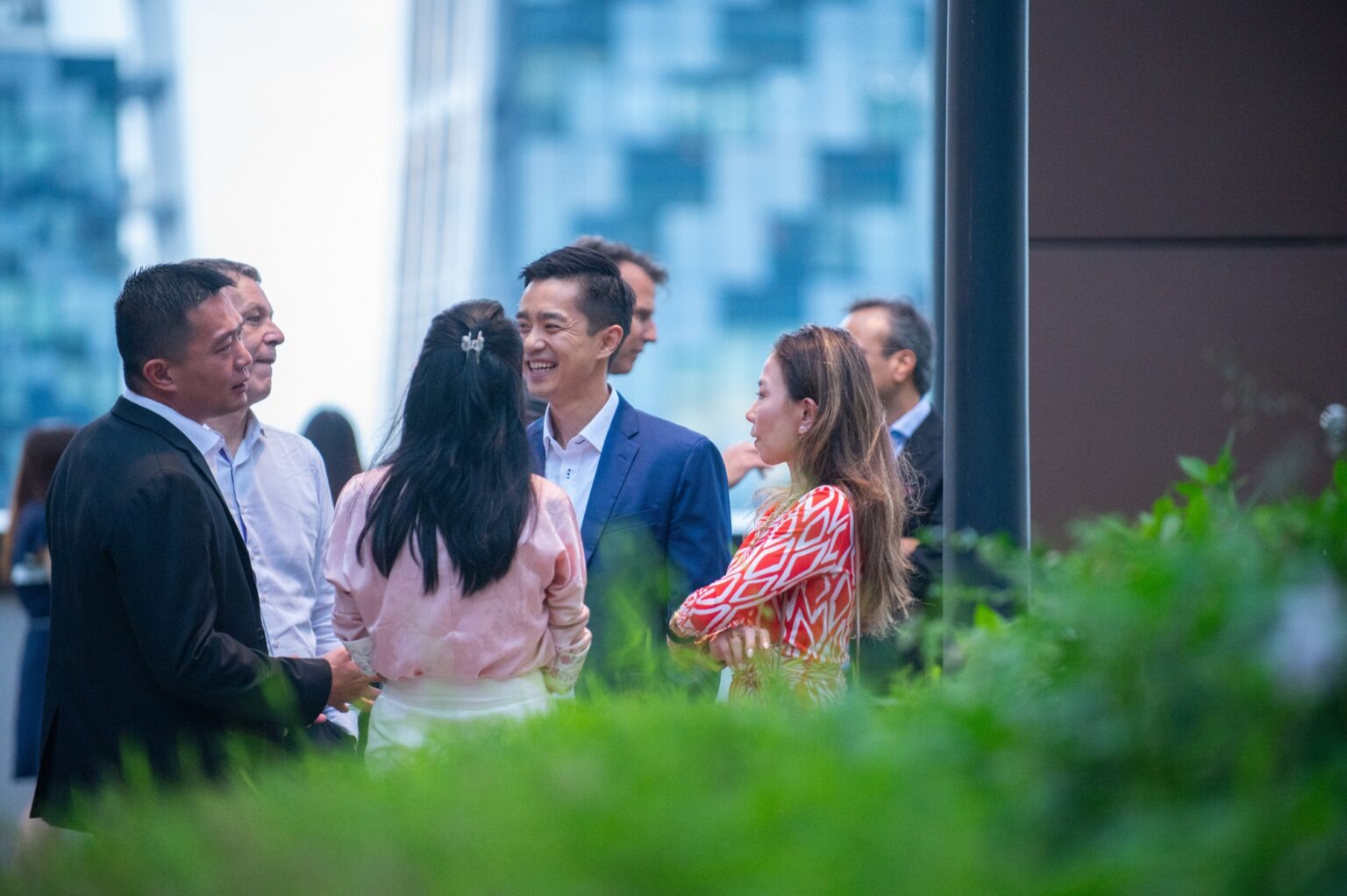 CEO and guests talking during the company’s office grand opening
