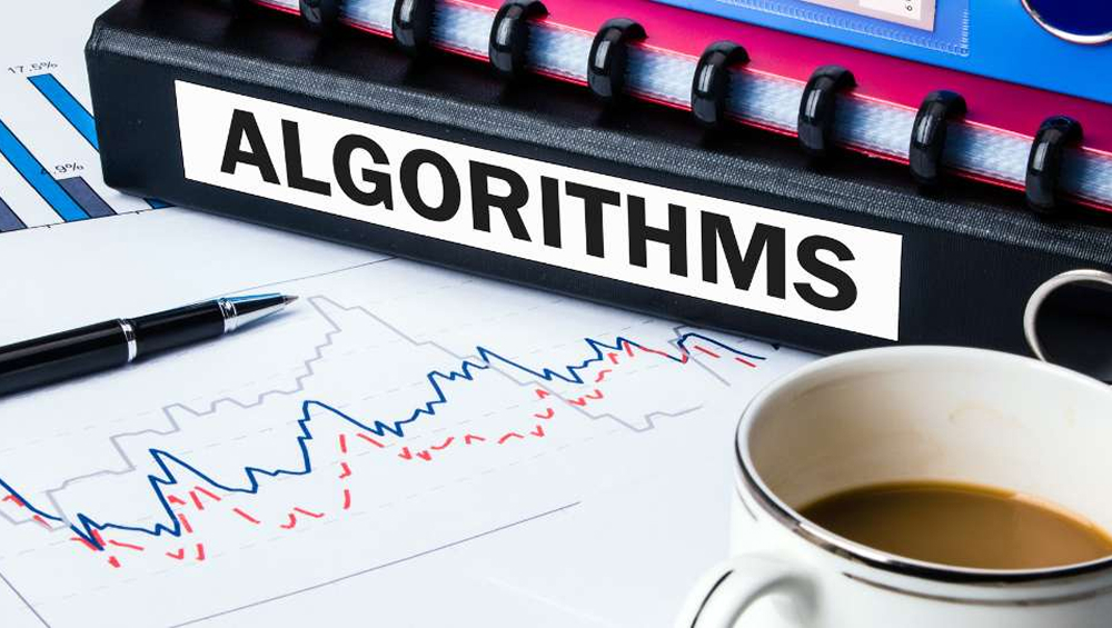 A hand-drawn graph and an algorithm table side by side, accompanied by a cup of coffee
