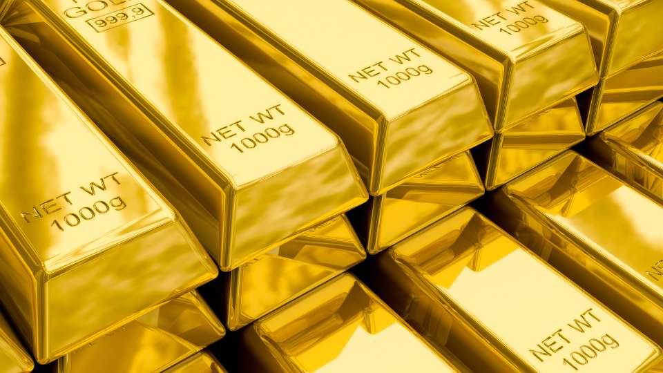 A detailed, golden stack of standardized 1000g gold bars, emphasizing commodity investment and high-grade precious metal.