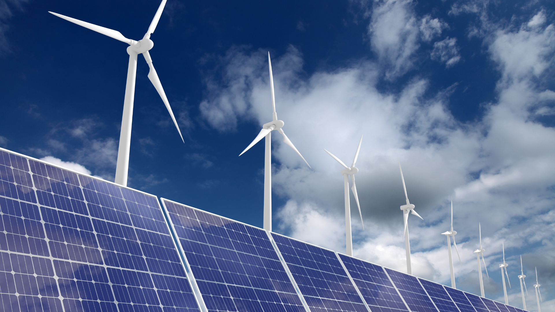 Solar panels and wind turbines generating renewable energy under a blue sky.