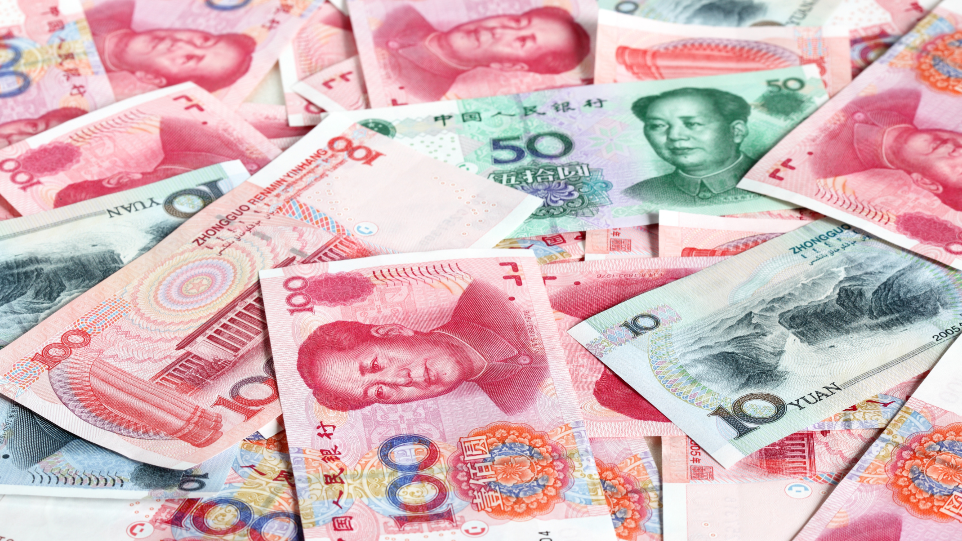 Close-up of Chinese yuan banknotes in various denominations.