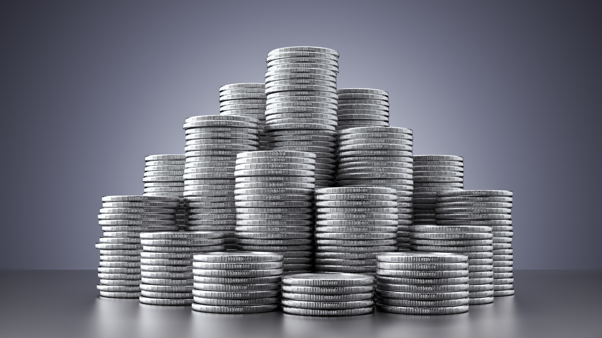 Stacks of silver coins arranged in a pyramid shape, symbolizing wealth and financial growth.