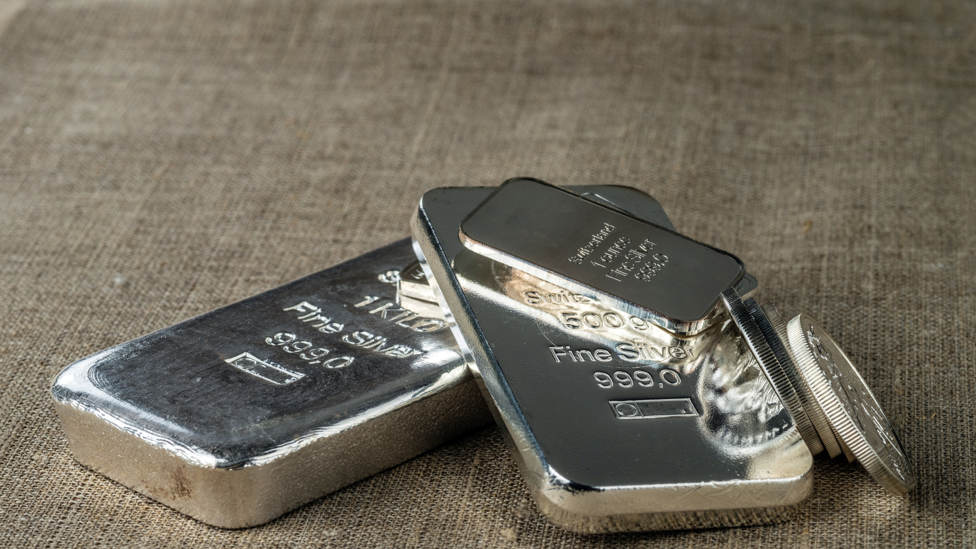 Silver bullion. Cast and minted silver bars and coins