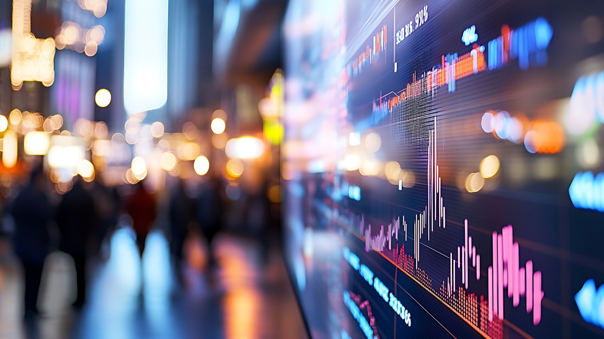 Digital financial charts displaying price movements and volume indicators against a blurred urban background, representing global market activity and trading dynamics.
