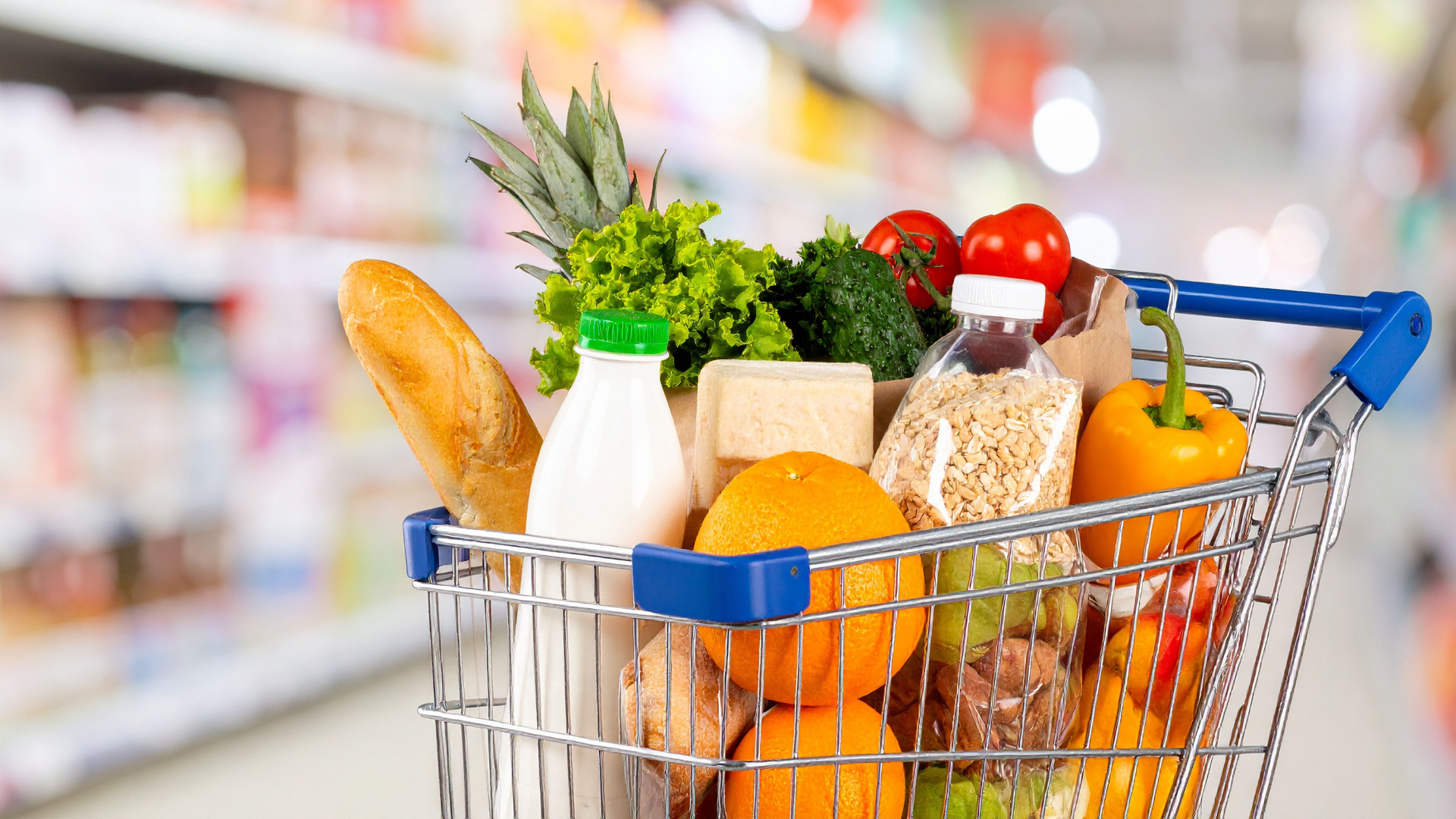 Shopping Cart Full of Groceries in Supermarket