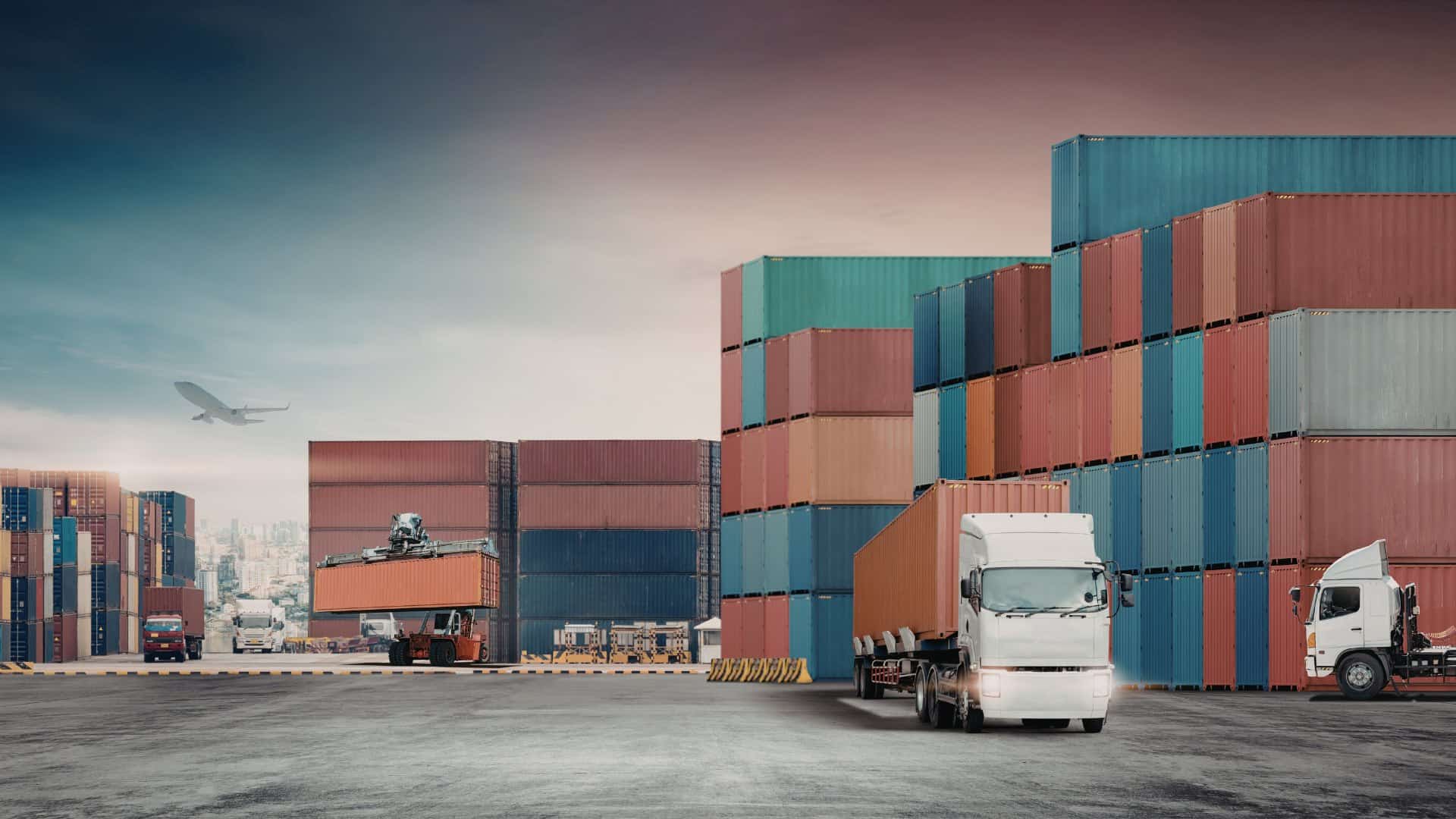 Container yard with trucks and shipping containers